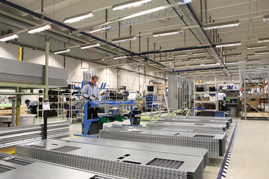 Scanfil employee assembling mechanics at Scanfil factory