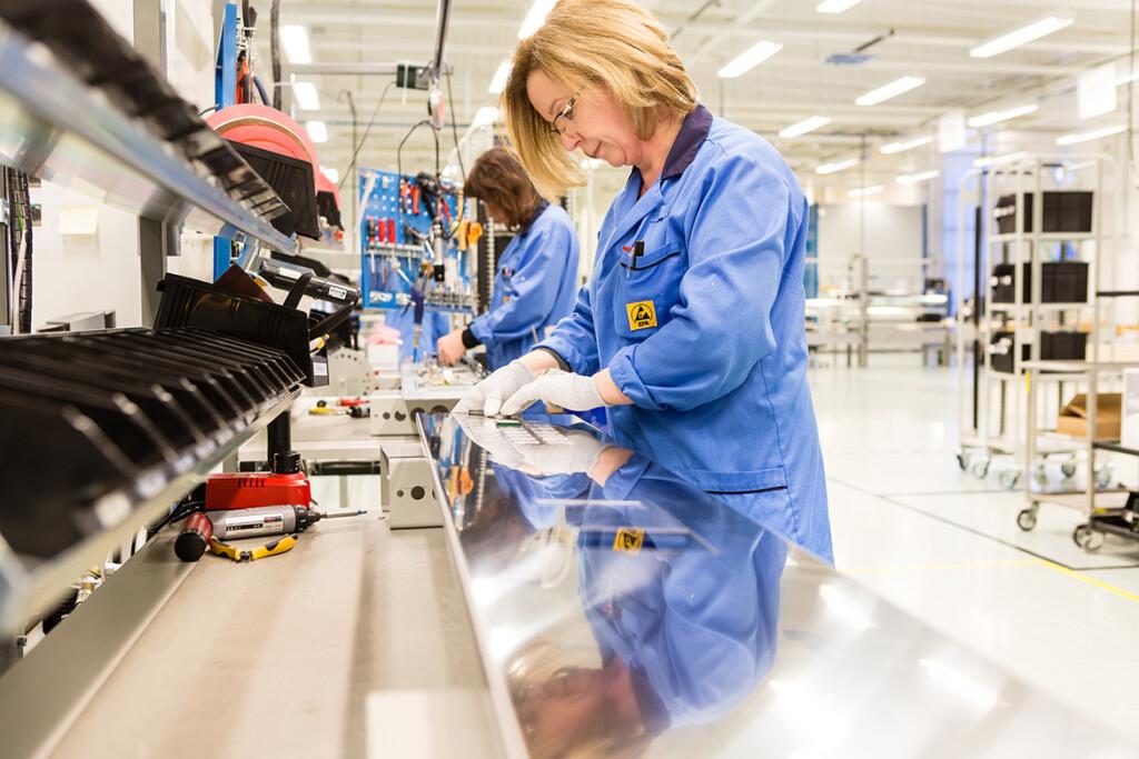 Scanfil technician working with repair and refurbish at Scanfil factory. Our skilled technicians diagnose and repair assemblies, cables, and PCBAs, ensuring all repaired products meet OEM standards and are fully traceable through our management software.