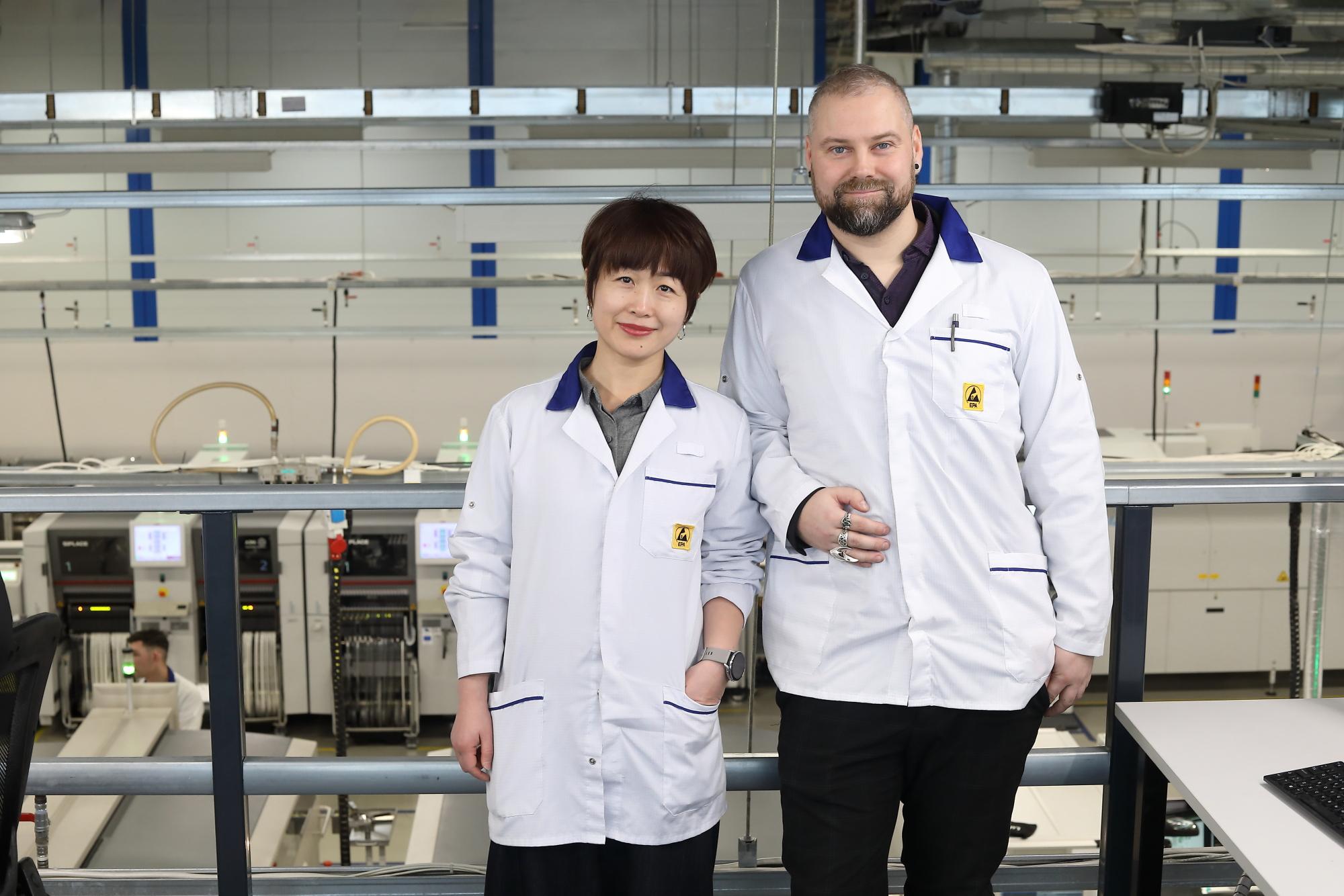 Two Scanfil employees at Scanfil factory