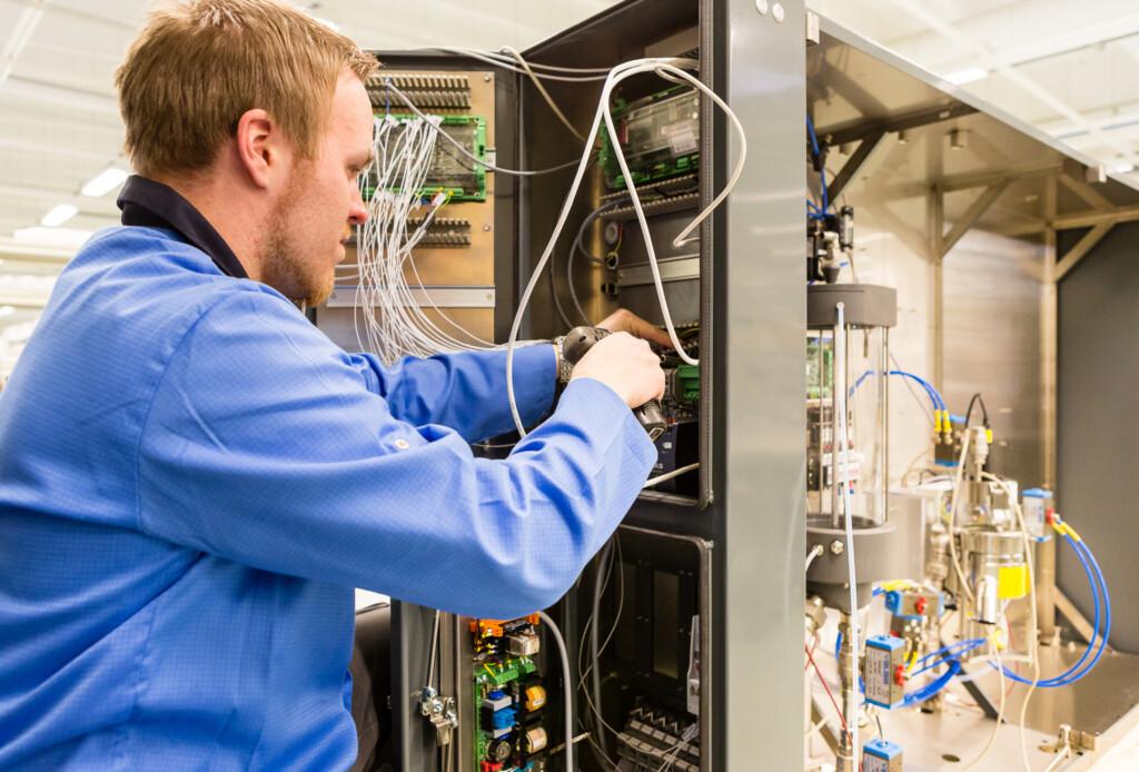 Scanfil employee combining the manufacture of electronics and mechanics into one technically advanced integrated equipment